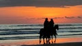 Silhouettes of horsemen who appeared at sunset Royalty Free Stock Photo