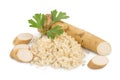 Horseradish root with slices grated pile and parsley isolated on white background Royalty Free Stock Photo