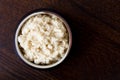 Horseradish sauce in rustic pottery bowl from above on dark wood Royalty Free Stock Photo