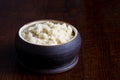 Horseradish sauce in rustic pottery bowl in perspective on dark Royalty Free Stock Photo