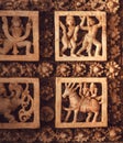 Horses and ancient people in dance, design on ceiling of 12th century historical stone Hindu temple, Halebidu, India.