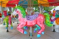 Horses on a carnival Merry Go Round in temple fair Royalty Free Stock Photo