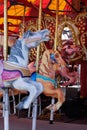 Horses in carousel, merry-go-round at carnival Royalty Free Stock Photo