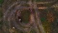 Horses with equestrians and a dog are going in circle on the field Royalty Free Stock Photo