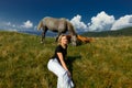 Horses graze high in the mountains