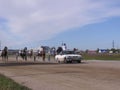 horses harnessed with a rider run for the start car at the racetrack for sports competitions in