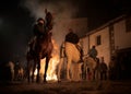 Horses jumping above the fire without fear