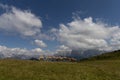 Horses in line in front of mountain panorama in Alpe di Siusi, South Tyrol, Italy Royalty Free Stock Photo