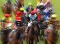 Horses race to the finish line on a Melbourne track, blur zoom effect.