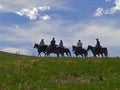 Horses and Riders on Ridge