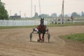 Horses and riders running at horse races