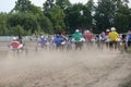 Horses and riders running at horse races