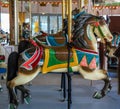 Horses on a traditional fairground B&B carousel at historic Coney Island Boardwalk in Brooklyn