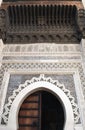 Horseshoe Arch decorated with Arabic Mosaic and Moroccan Arabesque Carvings at the Medieval Medina of Fes al Bali