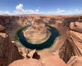 Horseshoe Bend on the Colorado River near Page Arizona on sunny late morning Royalty Free Stock Photo