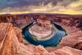 Horseshoe Bend on Colorado River at Sunset with Dramatic Cloudy Sky, Utah Royalty Free Stock Photo