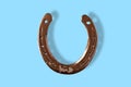 Horseshoe on a blue background, symbol, luck, good omen