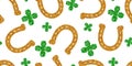 Horseshoe gold glitter. Hoof horse. Four-leaf green clover. Seamless pattern on white background. Vector illustration.