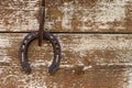 Horseshoe hanging on a wooden wall