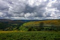 Horseshoe Pass A452 climbs rugged landscape under stormy sky Royalty Free Stock Photo