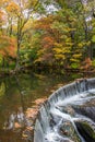 Horseshoe waterfall surrounded by fall foliage Royalty Free Stock Photo