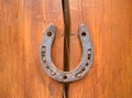 Horseshoe on a wooden crack. The concept of good luck and safety. Protect from destruction, failures and misfortunes.