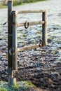 Horseshoes hanging on a open pasture gate on a sunny winter morning. Symbol of good luck, lucky charm in equestrian sports