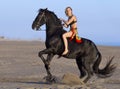 Horsewoman on the beach Royalty Free Stock Photo