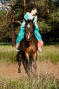 Horsewoman riding.