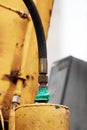 hose from the hydraulic system of the crane, crocked green tape Royalty Free Stock Photo