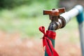 Hoses that connect to the faucet with an old connector at the back of the house Royalty Free Stock Photo