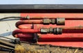 hoses and tubes of the hydraulic system from heavy machinery - Machine to hammer the piles in the construction road junction in M Royalty Free Stock Photo