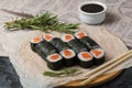 Hosomaki rolls closeup on a black plate with selective focus. Rolls with seaweed, rice, salmon Royalty Free Stock Photo