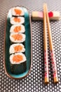 Hosomaki sushi and chopsticks placed on table Royalty Free Stock Photo