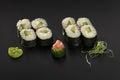 Hosomaki sushi rolls with avocado decorated with wasabi Royalty Free Stock Photo