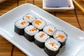 Hosomaki thin rolls, simple rolls, small rolls, with salmon. on a white plate. Syake Maki Classic roll with fresh salmon Royalty Free Stock Photo