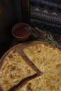 Khachapuri with meat on a wooden background
