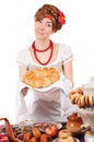 Hospitable russian woman offering traditional loaf Royalty Free Stock Photo