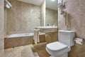 Hospital bathroom finished in marble. Shower, lavatory and washhand basin Royalty Free Stock Photo