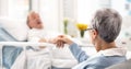 Hospital, bed and senior couple holding hands, empathy and chat about recovery support, medical problem or Royalty Free Stock Photo