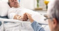 Hospital, bedroom and senior couple holding hands, empathy and support husband recovery, healthcare problem or Royalty Free Stock Photo