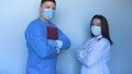 In the hospital clinic Two young doctors in lab coats a nurse and a doctor with a folder in their hands, scratching the synchron Royalty Free Stock Photo