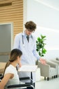 Hospital doctor explaining the results of the treatment and the progress of the treatment to the patient. Royalty Free Stock Photo