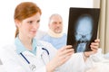 Hospital - female doctor examine patient x-ray Royalty Free Stock Photo