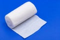 Hospital Grade Sterile White Rolled Gauze on blue Royalty Free Stock Photo