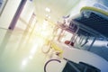 Hospital hall with a bright illuminated exit, defocused background