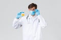 Hospital, healthcare workers, covid-19 treatment concept. Lab technician, doctor examine urine sample in laboratory