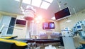 Hospital interior with operating surgery table, lamps and ultra modern devices, technology in modern clinic. Royalty Free Stock Photo