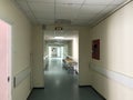 Hospital interior: view of a long corridor with light walls in the hospital