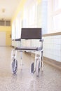 Hospital invalid chair on hospital corridor